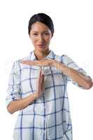 Woman making a timeout hand gesture