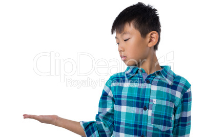 Boy pretending to hold invisible object