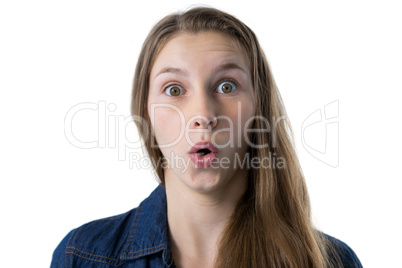 Teenage girl surprised against white background