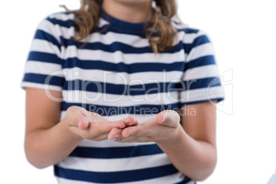 Mid section of girl pretending to be holding invisible object