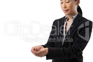 Smiling businesswoman with hand cupped against white background