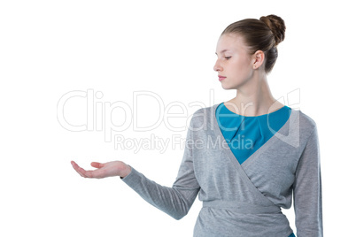 Teenage girl pretending to hold invisible object