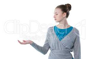 Teenage girl pretending to hold invisible object