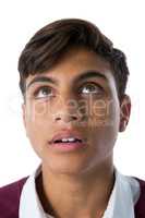 Teenage boy standing against white background