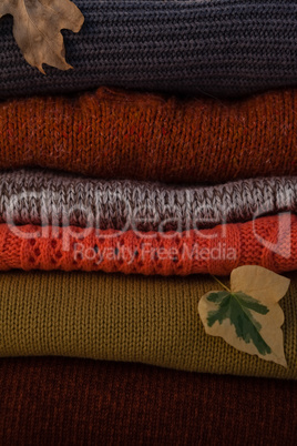 Woolen stack with autumn leaves