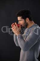 Thoughtful man having a mug of coffee