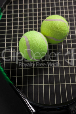 High angle view of tennis balls on racket