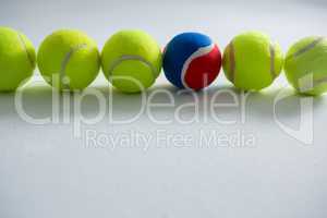 Tennis balls arranged on white background