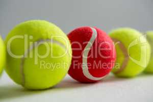 Close up of red and fluorescent tennis balls