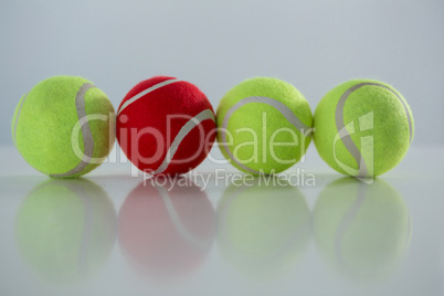 Red and fluorescent tennis ball