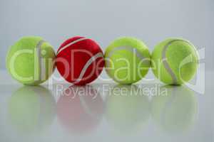 Red and fluorescent tennis ball