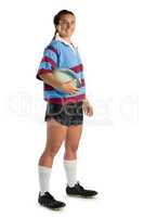Full length portrait of happy young female player with rugby ball