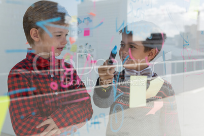 Kids as business executives discussing over whiteboard