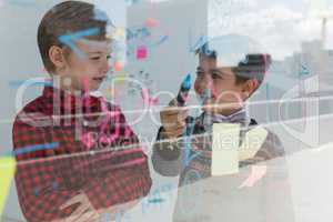 Kids as business executives discussing over whiteboard