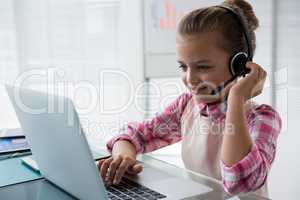 Girl as customer care executive smiling while working