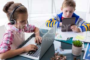 Kids as business executives working together in office