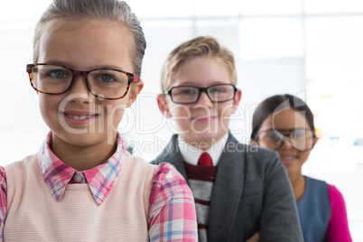 Kids as business executive smiling while standing in the office