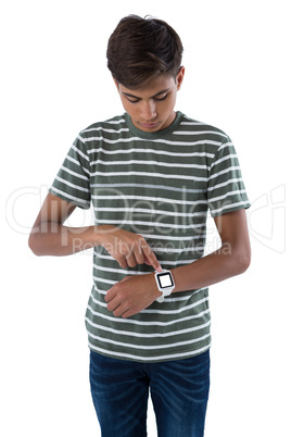 Teenage boy operating his smartwatch