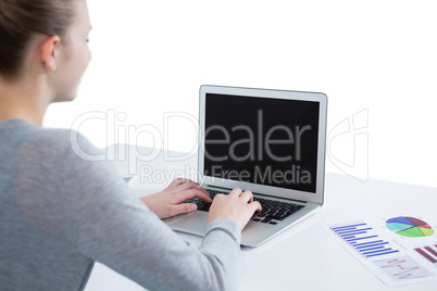 Teenage girl using laptop