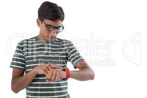 Teenage boy operating his smartwatch