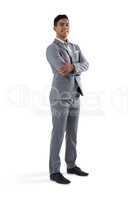 Businessman standing with arms crossed on white background