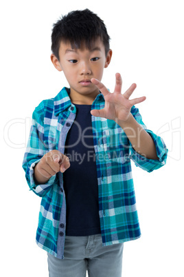 Boy pretending to touch an invisible screen