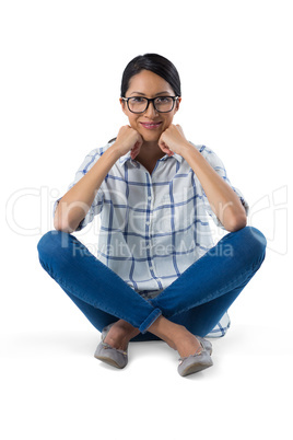 Woman relaxing against white background