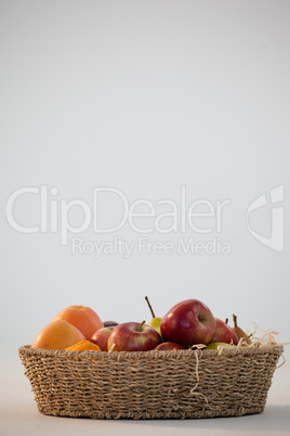 Close-up of various fruits in wicker basket