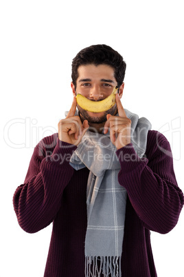 Portrait of smiling man holding banana