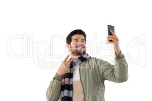 Smiling man taking selfie from mobile phone