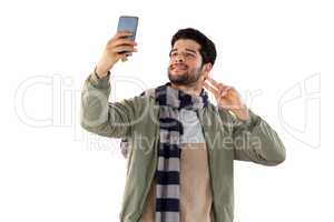 Smiling man taking selfie from mobile phone