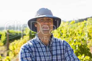 Handsome farmer smiling in field on a sunny day