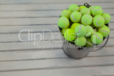 High angle view of tennis balls in metallic bucket