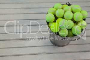 High angle view of tennis balls in metallic bucket