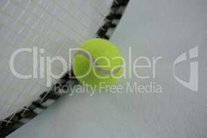 Close up of tennis ball by racket