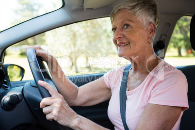 Senior woman driving a car