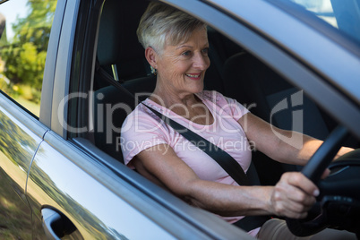 Senior woman driving a car