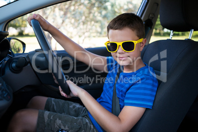 Teenage boy driving a car