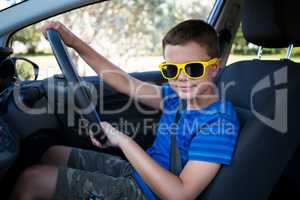 Teenage boy driving a car