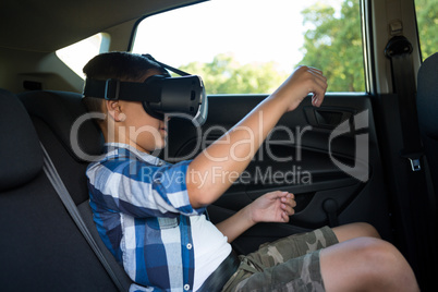 Teenage boy using virtual reality headset