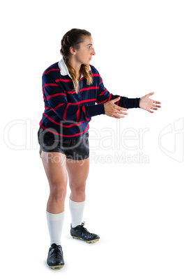 Full length of female playing playing rugby