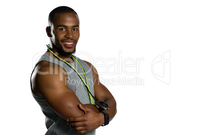 Portrait of smiling male instructor with arms crossed