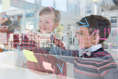 Kids as business executives discussing over whiteboard