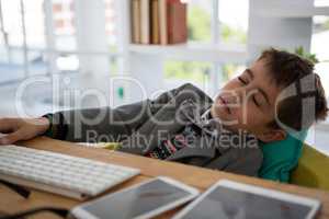 Boy as business executive sleeping