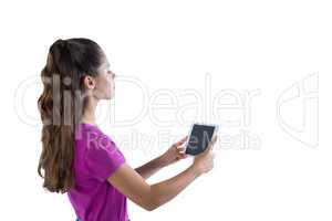 Teenage girl using digital tablet