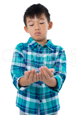 Boy pretending to hold invisible object