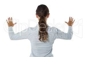 Female executive gesturing against white background