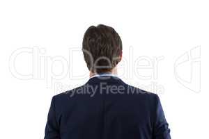 Businessman looking at invisible virtual screen against white background