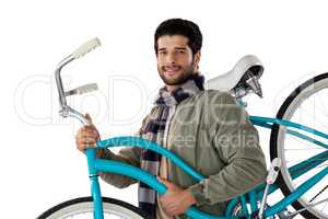 Portrait of smiling man carrying a bicycle