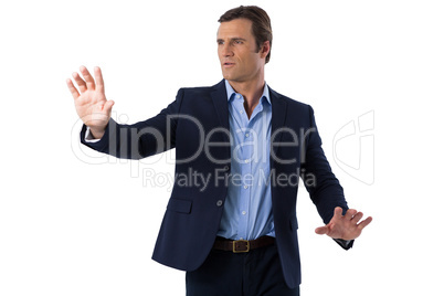 Businessman touching the invisible screen